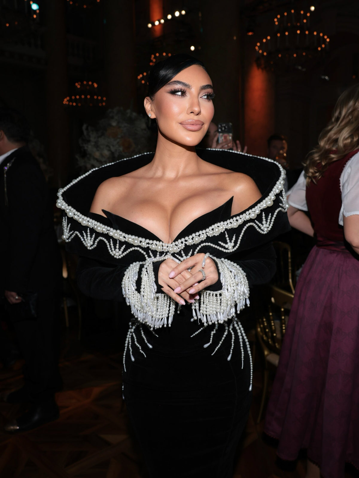Black velvet gown with pearl collar and fringe, Dodona Avdiu