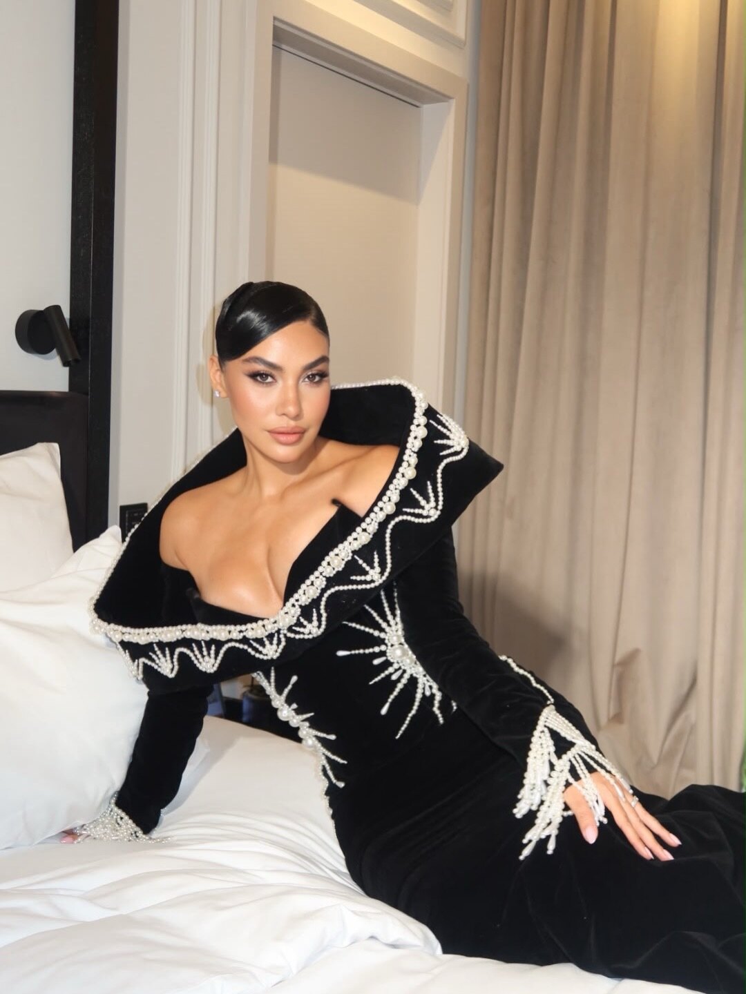 Black velvet gown with pearl collar and fringe, Dodona Avdiu