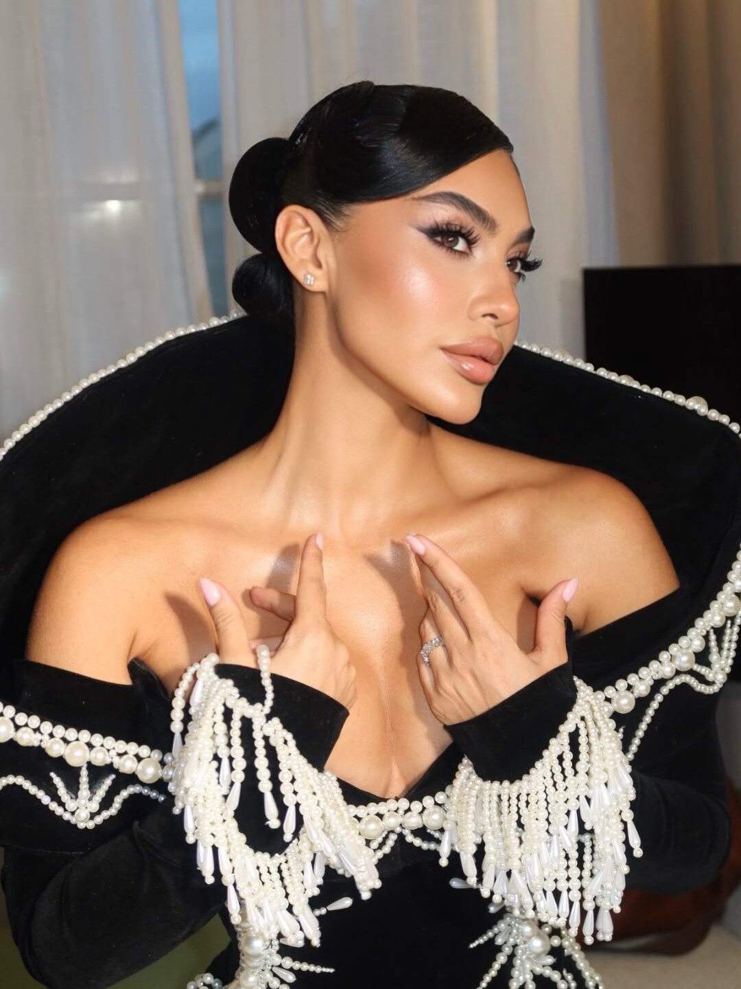 Black velvet gown with pearl collar and fringe, Dodona Avdiu